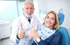 Cosmetic dentist in Milton and patient giving thumbs up sign
