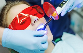 Woman receiving cosmetic dental bonding treatment