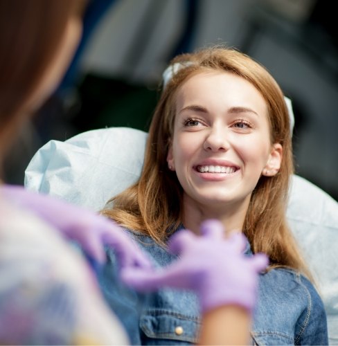 woman talking with dentist