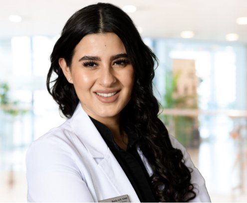 Patient talking with team member at front desk