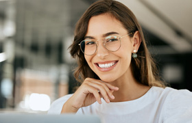Close-up of woman with glasses smiling
