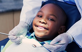 Young boy smiling during children's dentistry visit