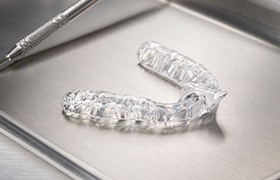 Clear nightguard for bruxism on metal tray