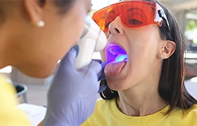 Patient receiving oral cancer screening