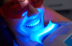 patient getting professional in-office teeth whitening
