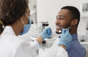 man at a checkup with his dentist 