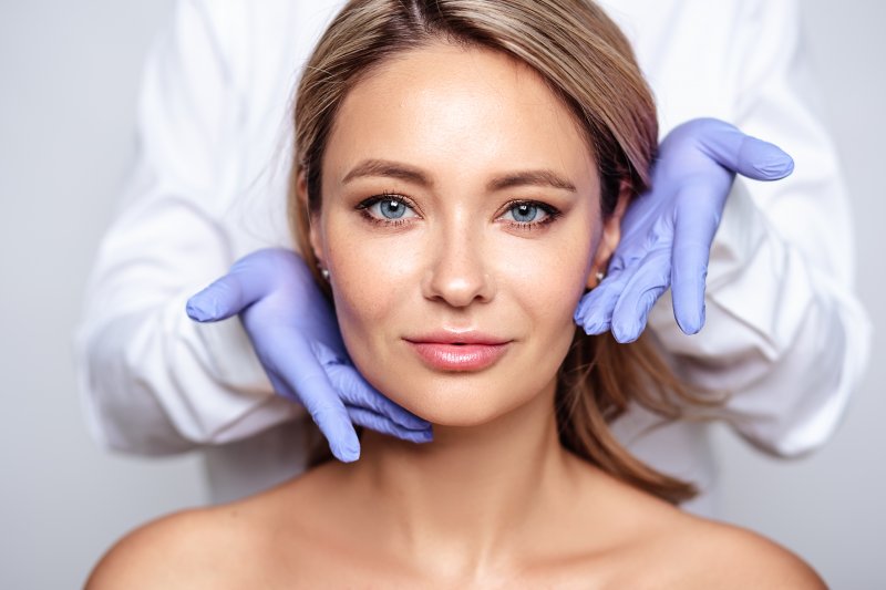 A woman smiling after her BOTOX treatment