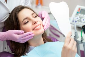 Woman enjoying her cosmetic dental treatment results