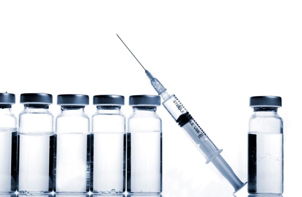 A series of bottles of BOTOX and a needle